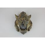 A 19th century gilt brass wall plaque of a roaring lions head 15cm