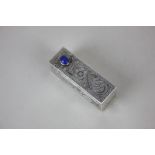 An Italian 800 silver lipstick case with fold-out mirror and blue stone set thumb piece, marked