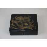 A Chinese black lacquer box depicting a stork by a lake, signed, 15.5cm
