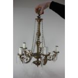 A gilt metal five-branch chandelier light fitting strung with glass droplets, approximately 46cm, (