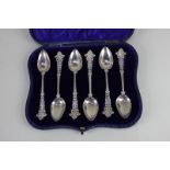 A cased set of six George V silver teaspoons with pierced decorative terminals, makers Alexander