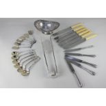 A pair of silver plated asparagus tongs, a bonbon dish, a set of six knives, two sets of six spoons,
