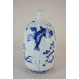 A Chinese blue and white porcelain vase depicting vegetables, 24.5cm high