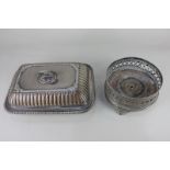 A large silver plated bottle coaster, together with a rectangular entree dish