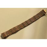 A 9ct three-colour gold herringbone mesh bracelet, 33.2g