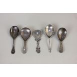 A George VI Scottish silver caddy spoon with dolphin twist handle and ship finial, Glasgow 1937,