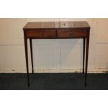 A mahogany clerk's table with rectangular top and two drawers, on slender square tapered legs to