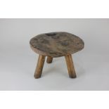 A 19th century burr walnut circular three-legged stool, 28cm diameter