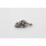 A diamond foliate design brooch set throughout with graduated old cuts