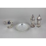 A mid-20th century silver three-piece cruet set of salt, pepper and mustard pot, faceted baluster