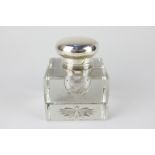 A Victorian silver topped glass inkwell, square shape with chamfered edges (small chip to back