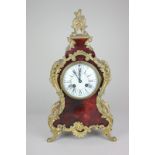 A 19th century French gilt metal mounted red tortoiseshell mantel clock with movement stamped L P