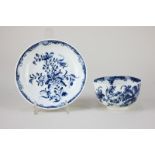 An 18th century Worcester blue and white porcelain tea bowl and similar saucer, with floral