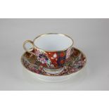 An early 19th century Worcester Flight Barr & Barr porcelain teacup and saucer, in Imari design, the