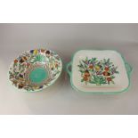 Two matching pieces of Charlotte Rhead Bursley Ware pottery, a bowl and a dish, depicting floral