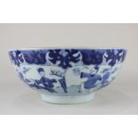 A Chinese blue and white porcelain bowl, the interior depicting a woman on a bridge with a hare, the