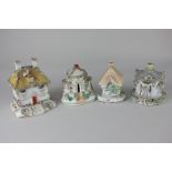 Four various Staffordshire pottery pastille burners modelled as cottages, to include three with a