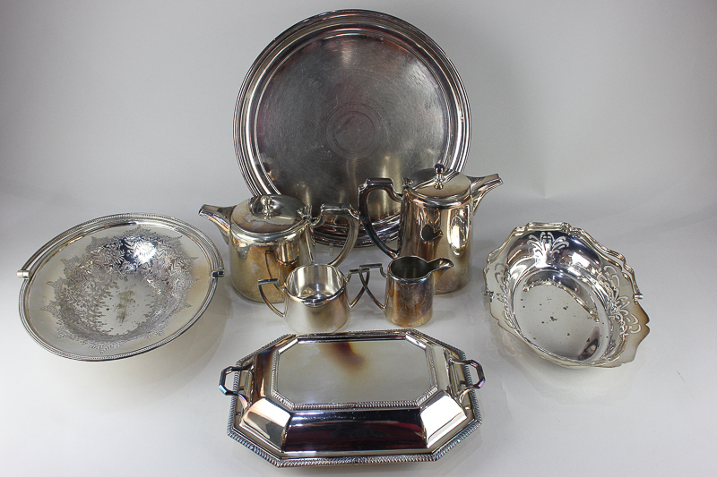 A Walker & Hall silver plated four-piece tea set, together with two cake baskets, a tray, an
