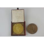 Two 1900 Paris Exposition Universelle medals comprising one gilt bronze, in original leather case,