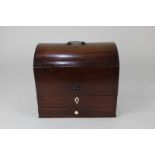 A Regency mahogany stationery box, the domed cover revealing leather pouch and three sections,