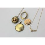 A 9ct gold and gem set necklace, a gold locket, and three gilt metal lockets