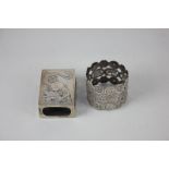 A Chinese white metal napkin ring, the pierced form decorated with character marks, together with