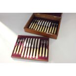 A set of twelve Victorian silver mounted ivory handled dessert knives and forks, makers Martin, Hall