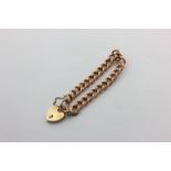 A 9ct rose gold curb link bracelet with padlock clasp, 15.1g