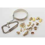 Eleven various charms, a pair of gold backed cufflinks, 14.5g weighable, a silver bangle and