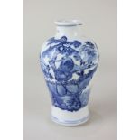 A Chinese porcelain blue and white baluster vase depicting cranes in a landscape, character marks to