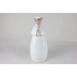 A Robj Paris figural flask in the form of a priest dressed in white robes, with gilt embellishments,