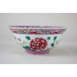 A Chinese porcelain bowl depicting chrysanthemums, seal mark to base, 13.5cm diameter