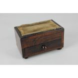 A Regency rosewood sewing box with velvet pincushion inset top above single drawer, on bun feet,