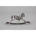 An Elizabeth II silver miniature model of a rocking horse, maker Douglas Pell Silverware, London