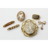 A George IV gold mourning brooch, two shell cameo brooches, and three gold bar brooches