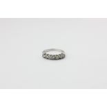 A diamond seven-stone ring, the graduated brilliant cuts on 18ct white gold