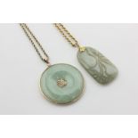 A Chinese gold mounted jade pendant on a 9ct gold ropework neck chain, and a carved jade pendant