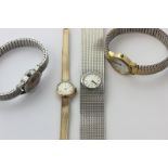 A lady's 9ct gold Omega bracelet watch, an Avia silver bracelet watch, and two other watches
