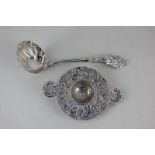 A Continental silver strainer, probably Dutch, with border of cherubs and scrolls, import mark for