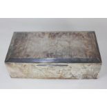 A George V silver cigar box, rectangular shape with engine turned top with chamfered edges, the
