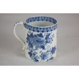 A 19th century pearl ware tankard with blue floral decoration and stylized border, 10cm high, (a/f)