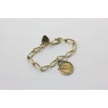 A 9ct gold wire link bracelet with padlock clasp hung with a 1965 sovereign, 27.6g