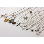 A collection of silver neck chains and pendants and a silver gilt thimble