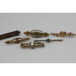 A group of six various gold and gem set bar brooches