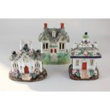 Three various Staffordshire pottery pastille burners modelled as cottages, largest 15.5cm