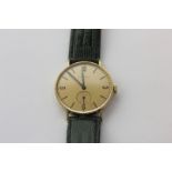 A gentleman's 18ct gold Longines wristwatch, manual movement with champagne dial