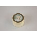 A 19th century ivory patch box, the lid with painted miniature of a woman in white dress and pearl