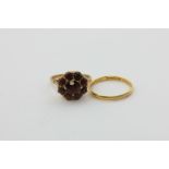 A 22ct gold wedding ring, 1.3g, and a garnet cluster ring in 9ct gold