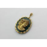 A gold and hardstone pendant mounted with the bust of a young lady with gem set hair