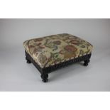 A late 19th / early 20th century rectangular carved mahogany footstool with tapestry style